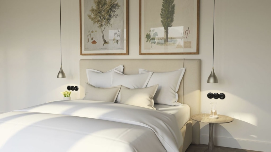 Bett in einem Zimmer der Alpenloge