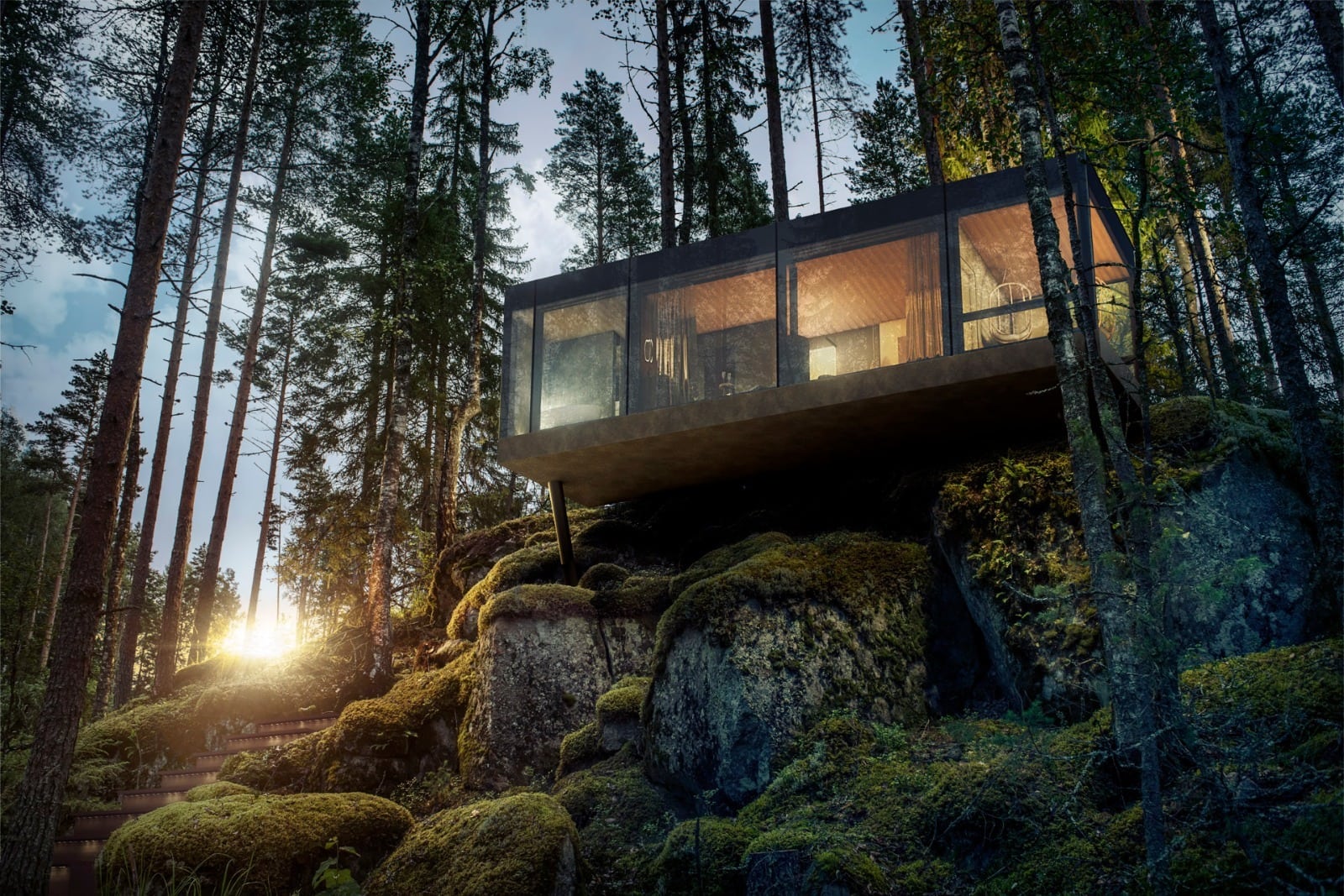 Auf einem Felsvorsprung in einem Wald thront ein eckiger Wohnpavillon, dessen Wände fast vollständig aus Fenster bestehen. Links dahinter geht die Sonne zwischen den Bäumen unter.