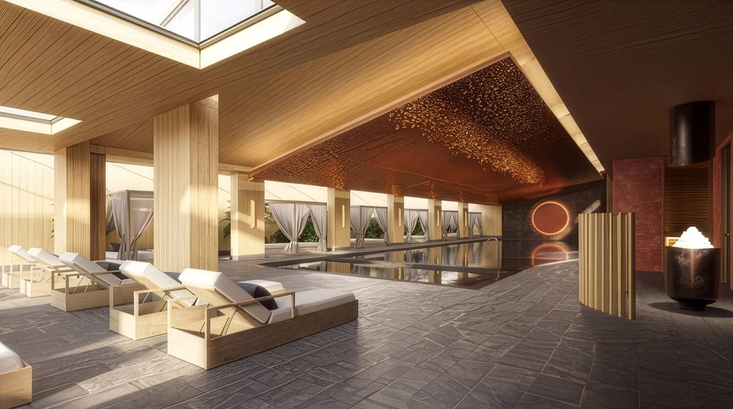 Innenpool eines Spas mit Holzdecke und Oberlichtern, gepolsterten Liegen aus hellem Holz und Steinboden in warmem Ambiente.