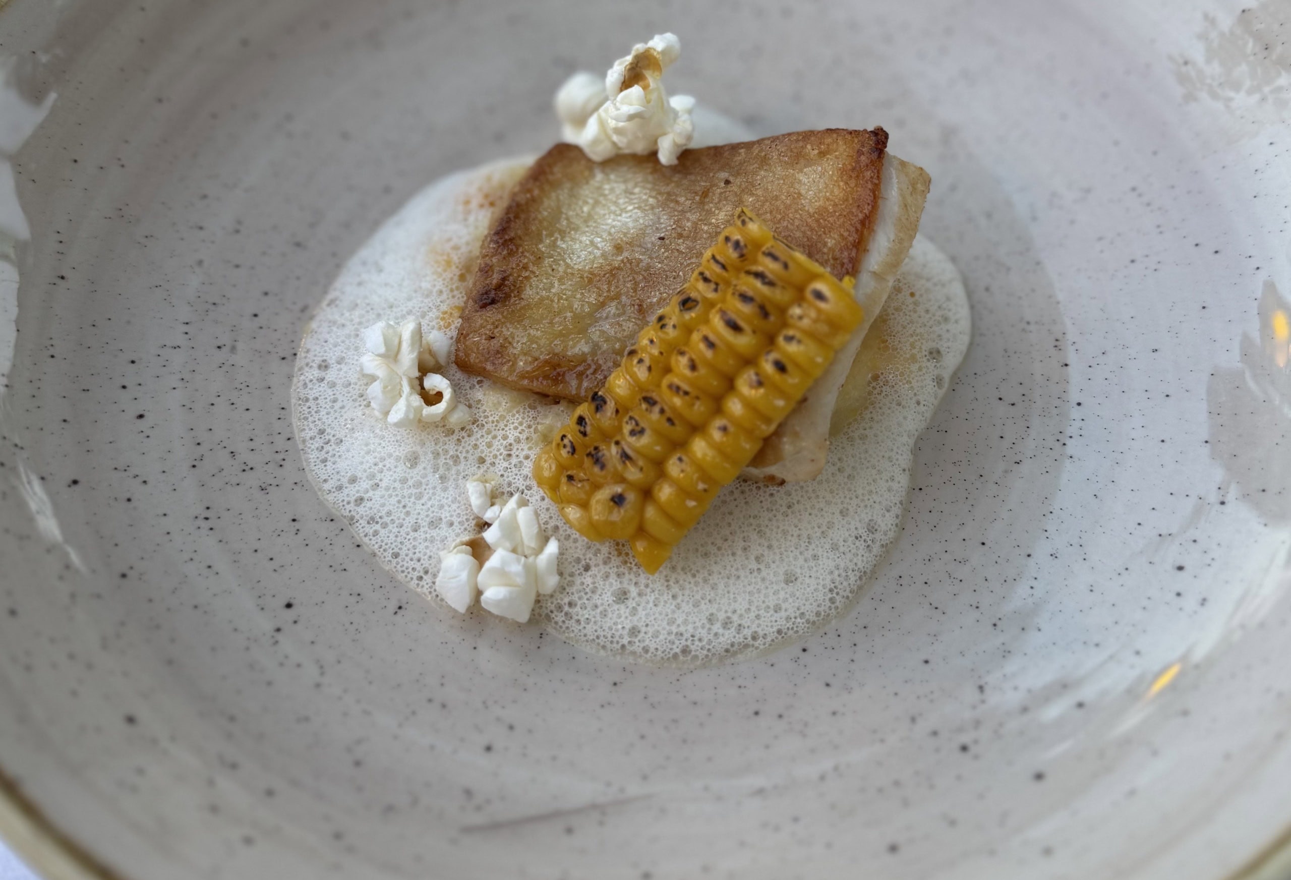 Bio-Goldforelle mit cremiger Polenta im Kehlberghof in Graz.