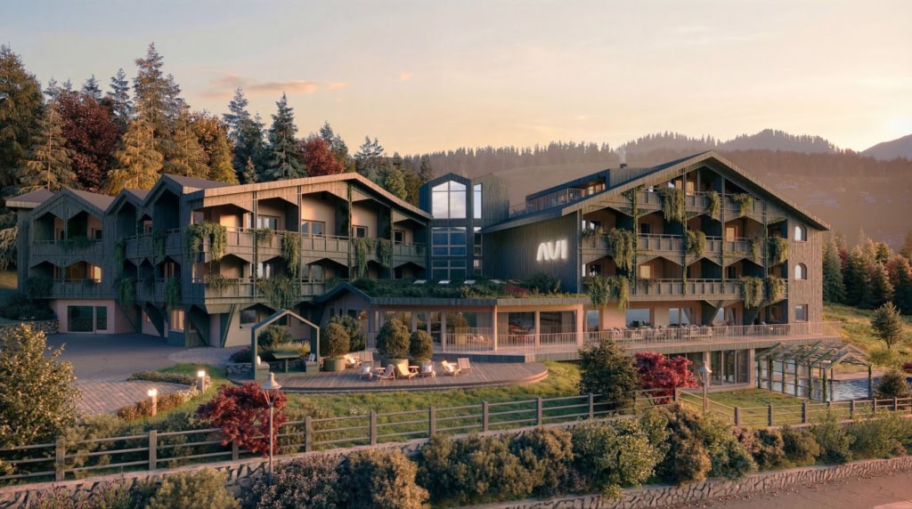 Aussenansicht des Hotel Aui in Meransen bei Sonnenuntergang mit moderner Chalet-Architektur und Holzfassade